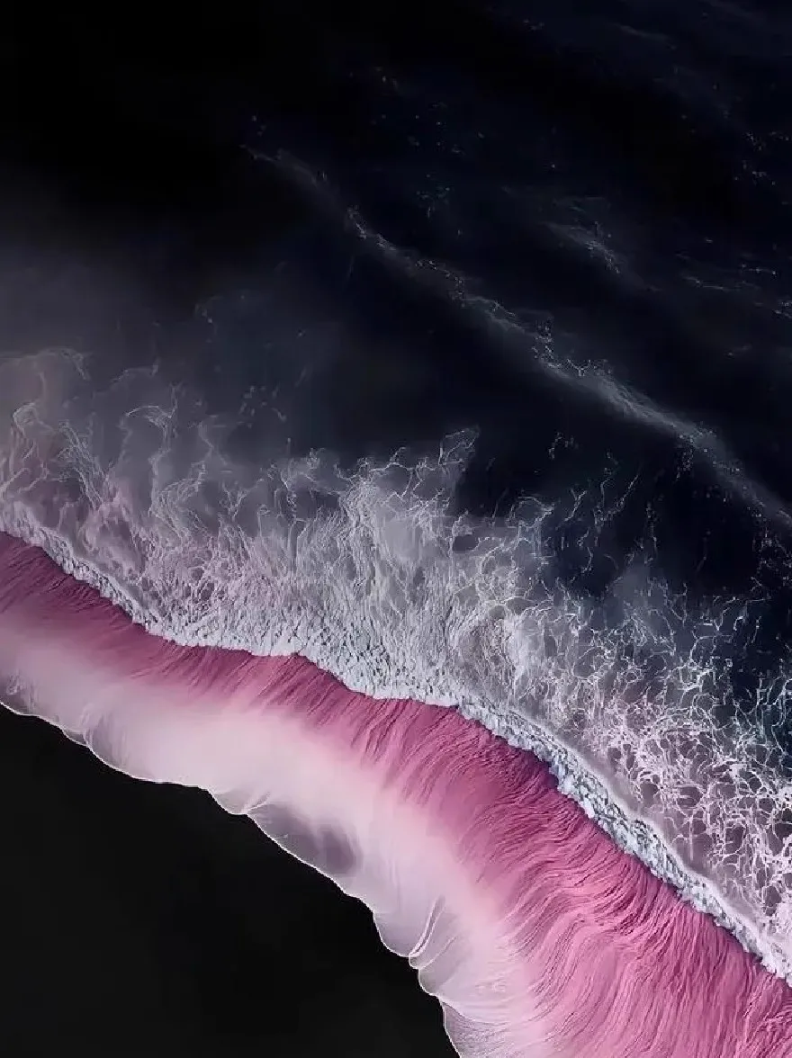 Русский промпт: A photograph taken from an aerial perspective, looking down at a vast expanse of ocean with dark, stormy skies. The foreground is dominated by a pink-tinted wave, with the ocean stretching out in front of it. The wave is foamy and turbulent, with white foam and spray visible on the surface. The sky is mostly dark, with some lighter clouds scattered throughout. The overall mood is dramatic and moody, with a sense of depth and movement. The photograph has a dreamy, ethereal quality. | Original prompt: A photograph taken from an aerial perspective, looking down at a vast expanse of ocean with dark, stormy skies. The foreground is dominated by a pink-tinted wave, with the ocean stretching out in front of it. The wave is foamy and turbulent, with white foam and spray visible on the surface. The sky is mostly dark, with some lighter clouds scattered throughout. The overall mood is dramatic and moody, with a sense of depth and movement. The photograph has a dreamy, ethereal quality.
