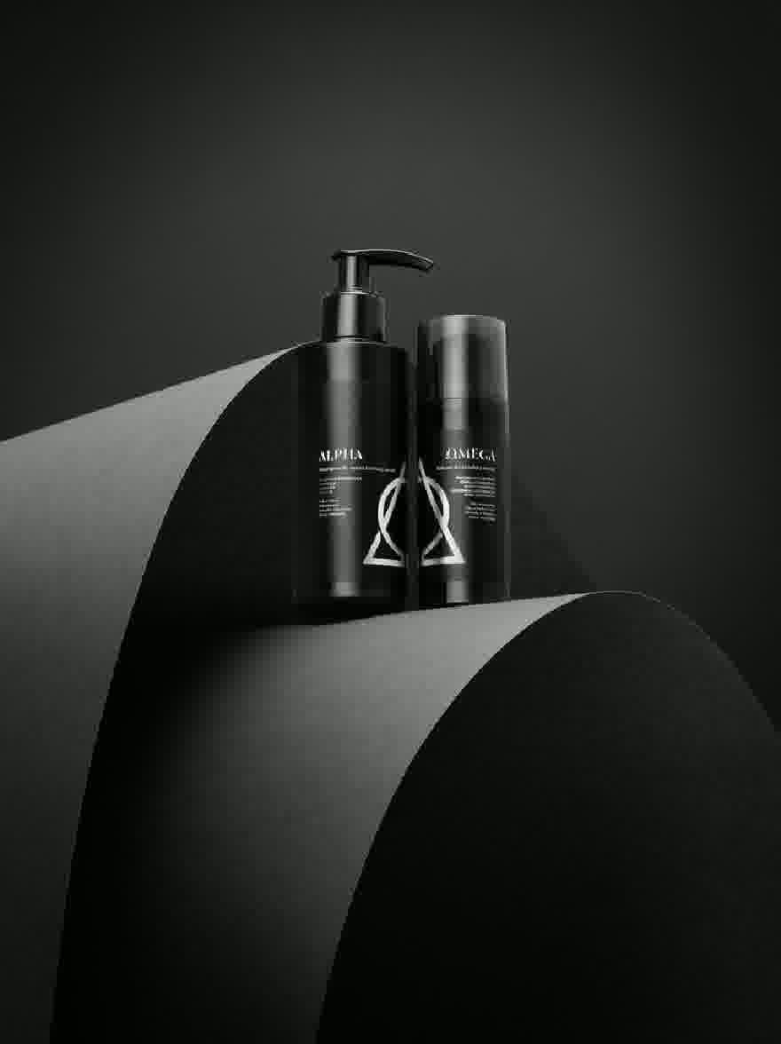 Русский промпт: Черно -белая фотография двух черных косметических бутылок с белыми этикетками, расположенная рядом на темной изогнутой поверхности. Бутылки имеют гладкий, современный дизайн с глянцевой отделкой. Метки имеют название бренда "Alpha" и "Omega" жирным шрифтом, белые надписи. Фон - твердый, темно -серый, обеспечивающий резкий контраст с бутылками. Общая эстетика минималистичная и минималистичная, с акцентом на продукты. | Original prompt: A black and white photo of two black cosmetic bottles with white labels, placed side by side on a dark, curved surface. The bottles have a sleek, modern design with a glossy finish. The labels feature the brand name "Alpha" and "Omega" in bold, white lettering. The background is a solid, dark grey, providing a stark contrast to the bottles. The overall aesthetic is minimalistic and minimalistic, with a focus on the products.